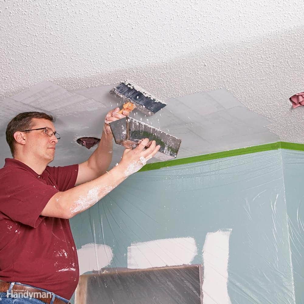 Drywall and Painting Mississauga scraping popcorn ceiling for a smooth finish